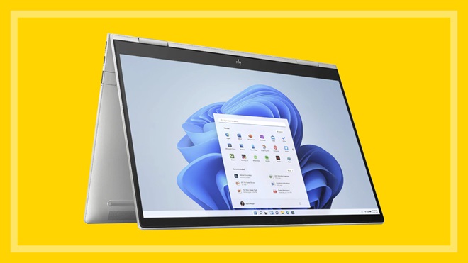 HP Envy x360 laptop on a yellow background